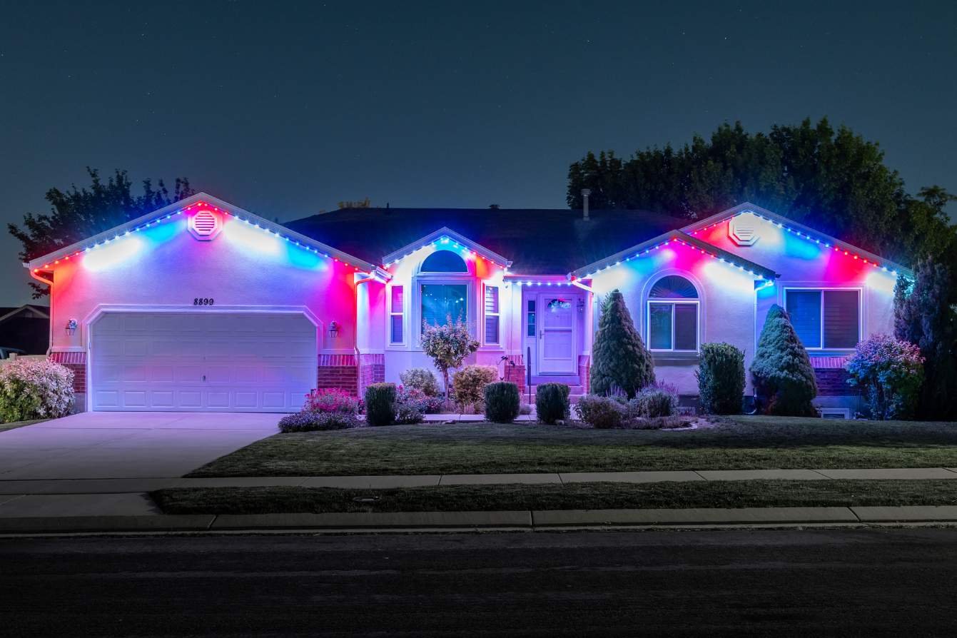 a wide home that features a patriotic color pattern with the new Trimlight 3L bulbs.