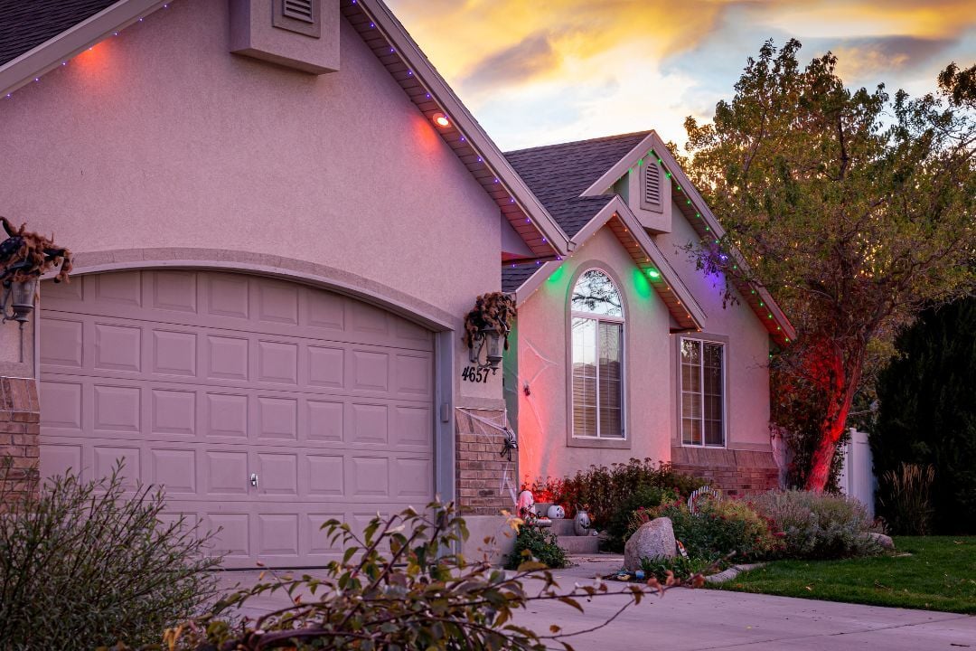 A home with downlights with accent lighting for Halloween