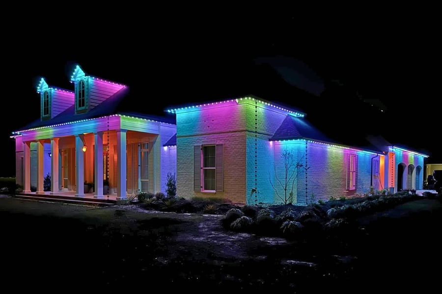 a home with 4 Easter LED colored Trimlight lights with 2 peaks.
