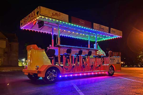 A mobile bike for business that has Trimlight along the roofline and bottom.