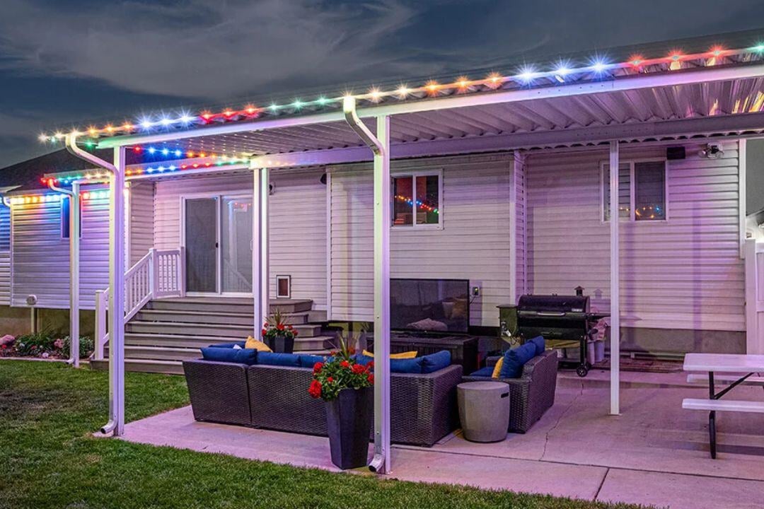 A picture of a patio with red, white and blue lighting pattern on the trim of the patio.
