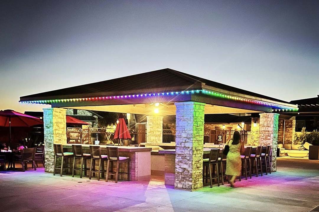 Colorful rainbow Trimlight display on bar