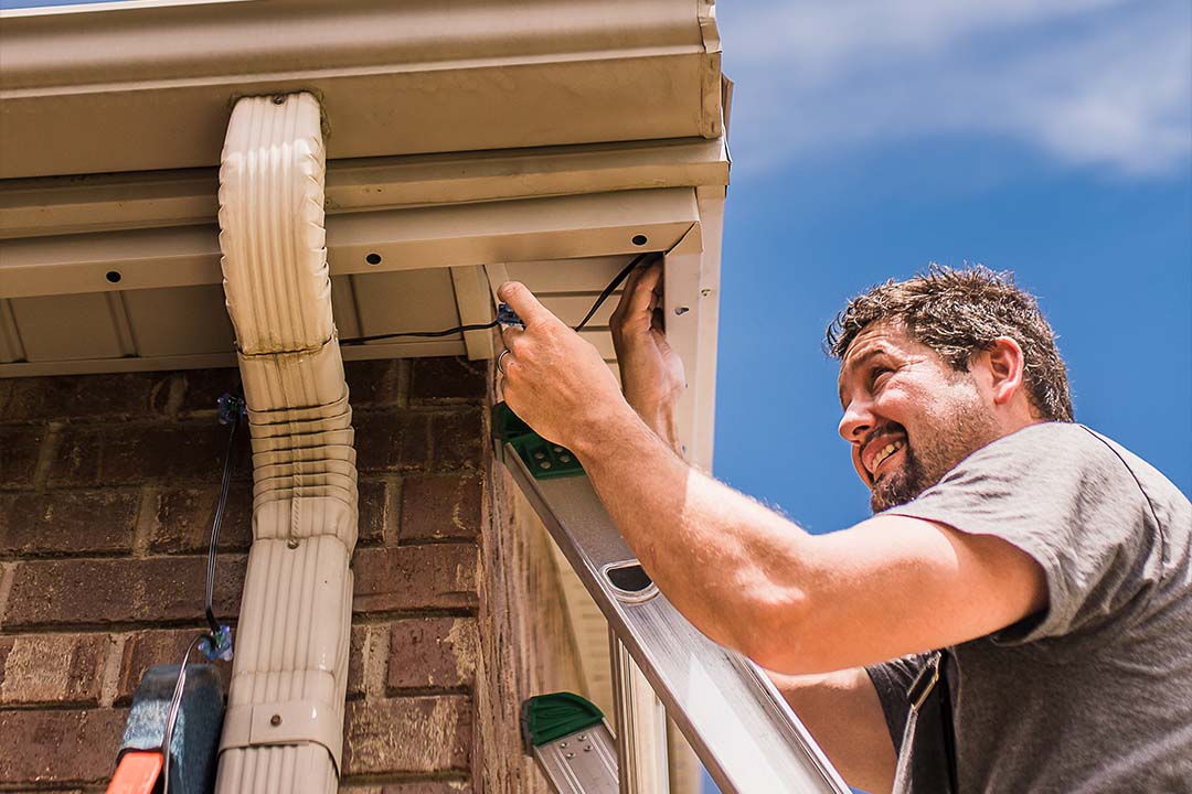 Technician installing LEDs for a home