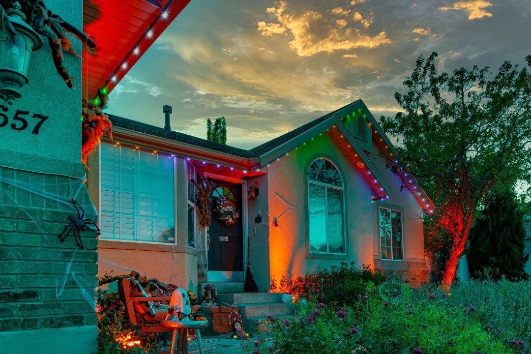 a home that has Halloween decoration and lighting pattern