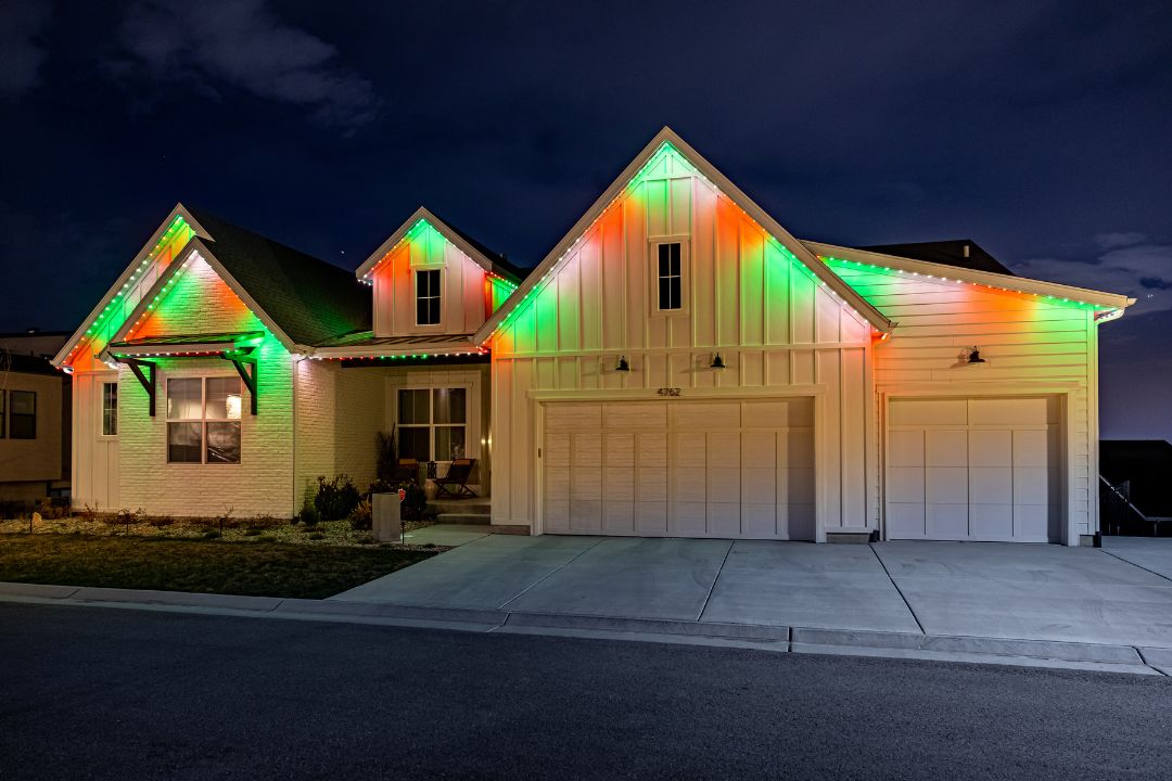 Outdoor holiday lights on white farmhouse